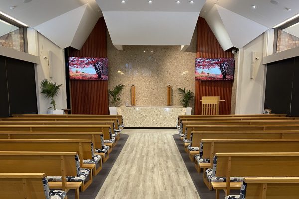 Peaceful Chapel Setting With Wooden Pews and Altar in Melbourne
