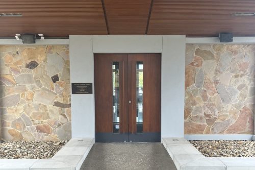Peaceful Chapel Setting With Wooden Pews and Altar in Melbourne